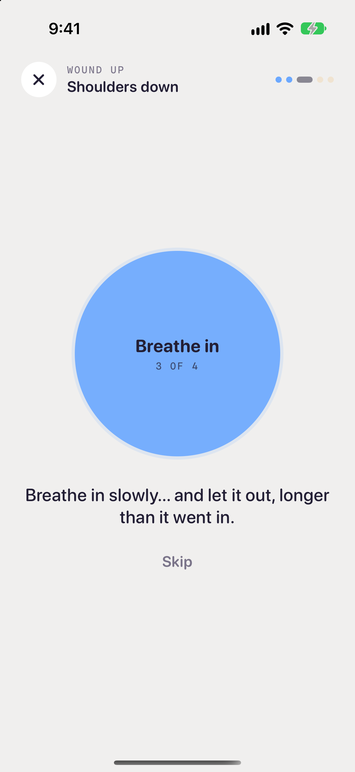 A Wound up pause called Shoulders down: a large blue circle that reads Breathe in, 3 of 4, with a Skip button.